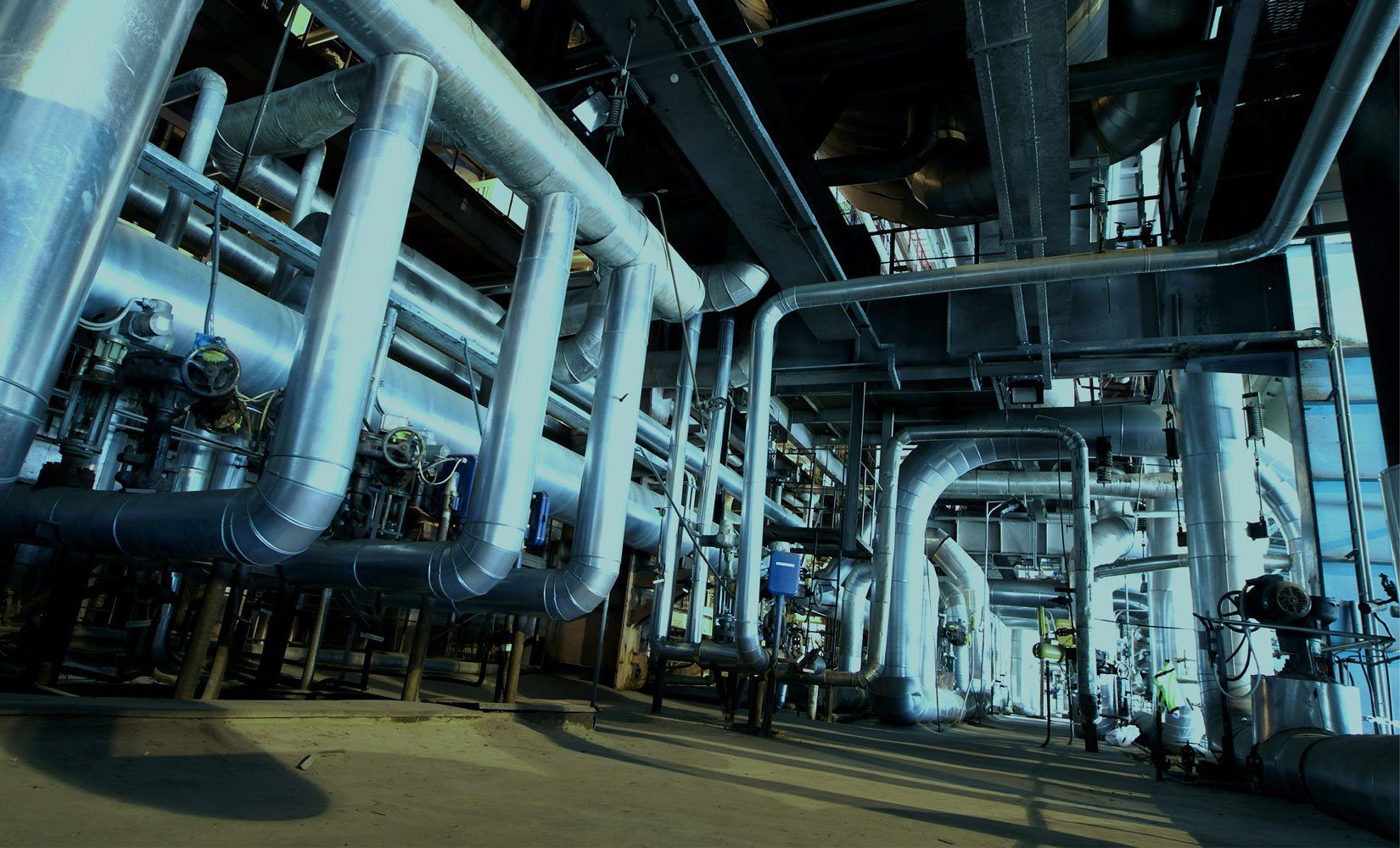 Industrial steel piping system in a commercial facility inspected for water leaks in Dubai.