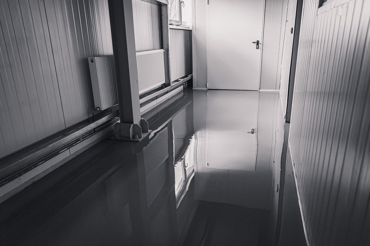 Flooded hallway Flooded commercial hallway with standing water on the floor.