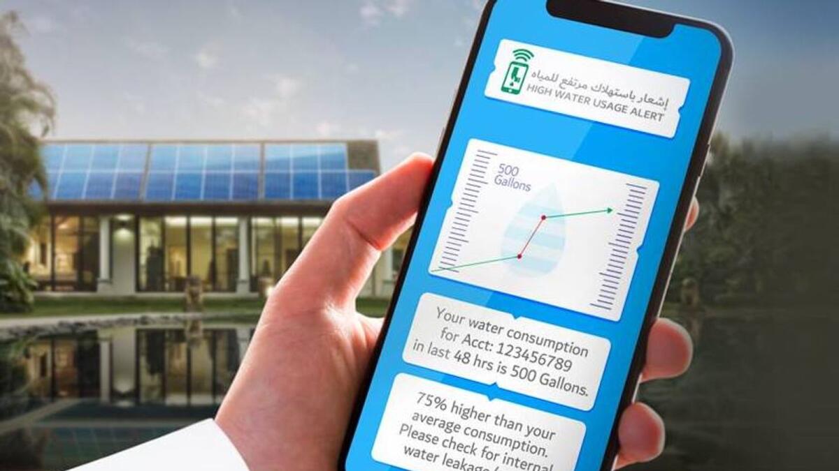 Smartphone showing DEWA high water usage alert and leak notification
