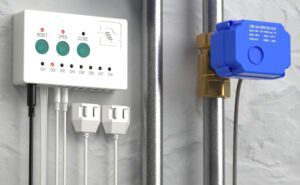 Electronic leak detection control panel with wired sensors and an automatic shutoff valve installed on a water pipe.
