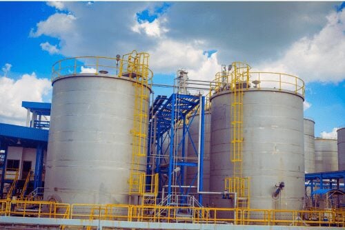 Large industrial holding tanks in a petrochemical factory