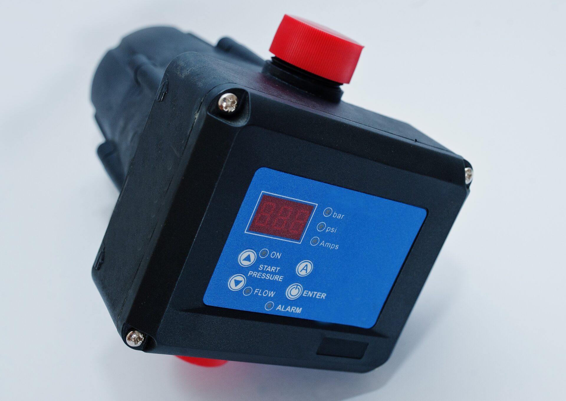 Man holding a phone showing a thermal infrared camera image used for detecting hidden water leaks